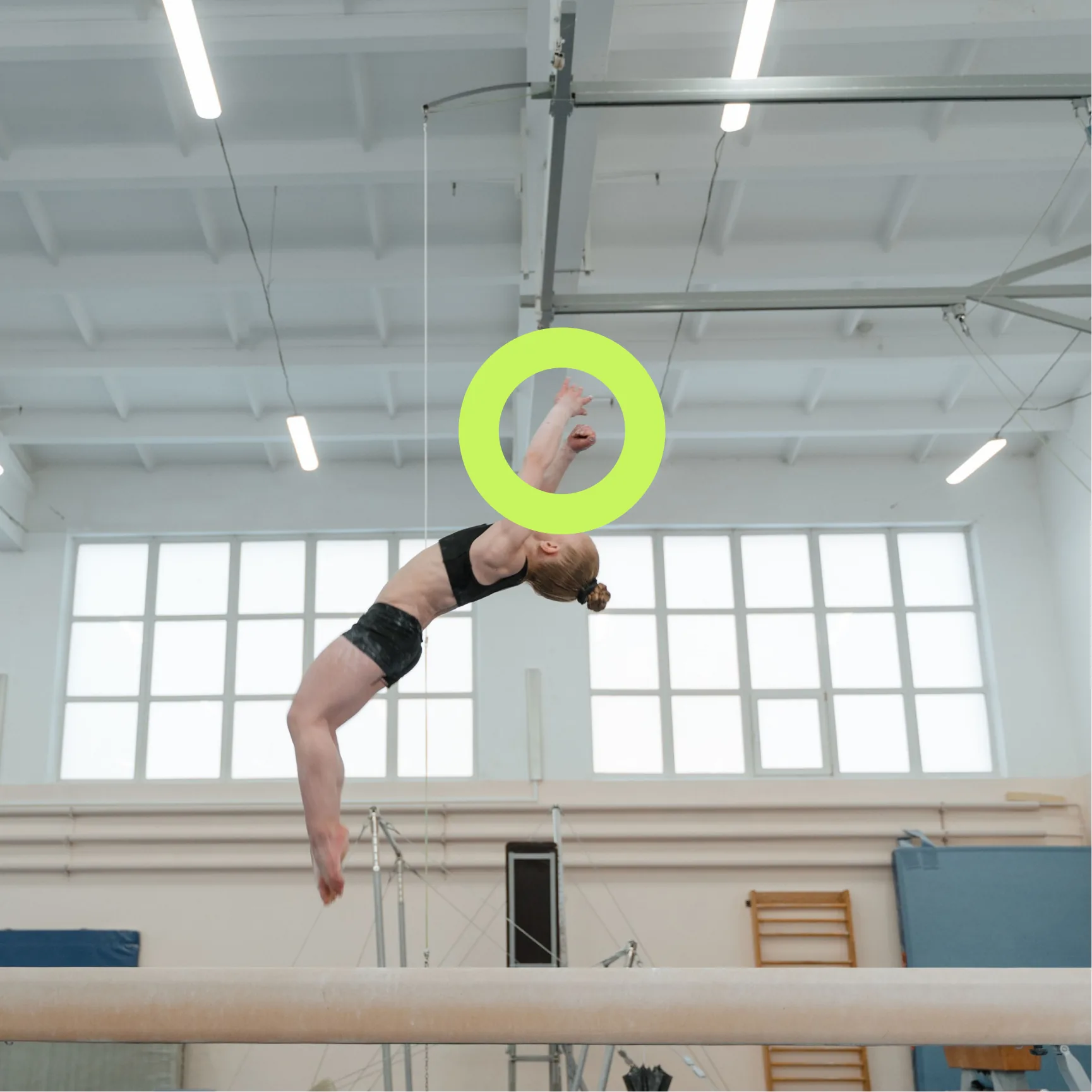 A gymnast training on the beam